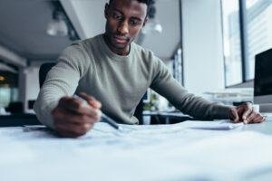 A black man planning a business development plan