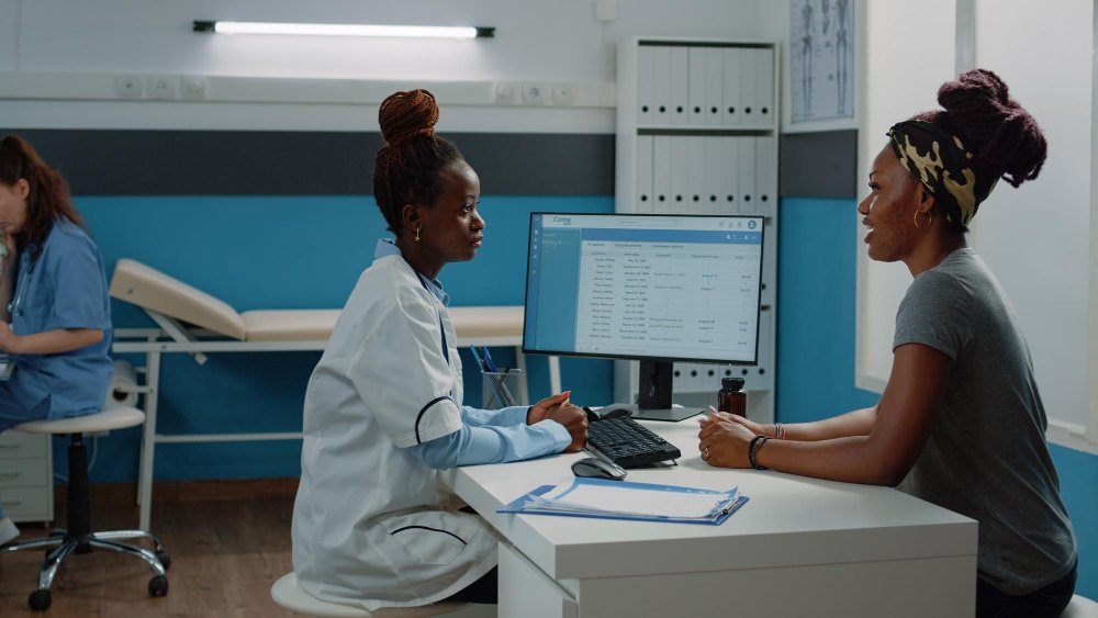 A doctor taking a patient information from the patient portal on the hospitals website