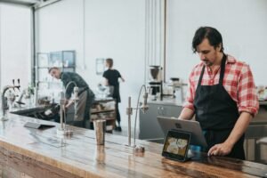 Business owner using application software on laptop